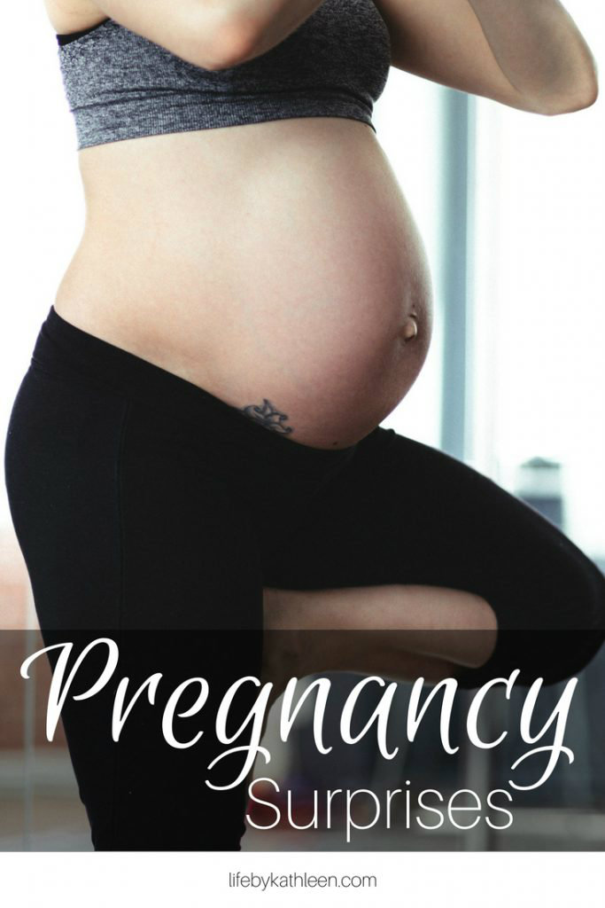 pregnant woman doing yoga text overlay: pregnancy surprises