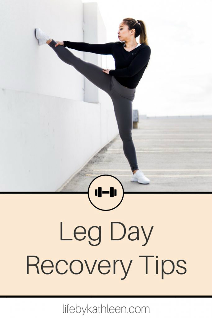girl stretching leg on the wall text overlay: Leg Day Recovery Tips